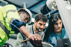 robotic-engineer-and-team-oversee-software-machin-2026-01-07-00-20-18-utc